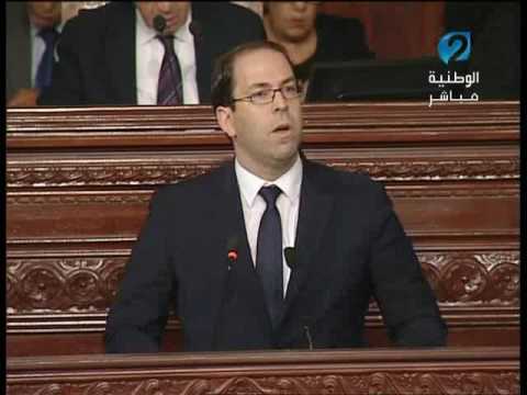 شاهد  رد رئيس الحكومة يوسف الشاهد