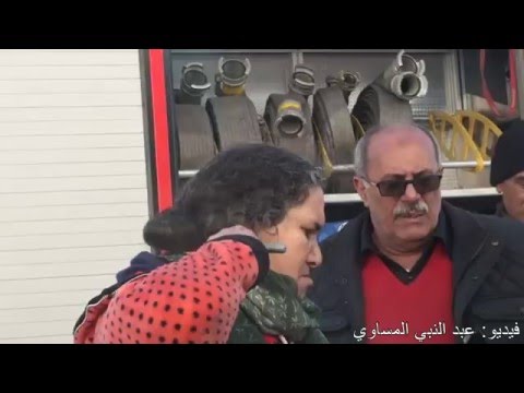 شاهداعتقال إمراة هددت بنحر نفسها
