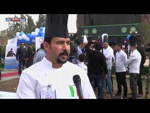 بالفيديو أطول فطيرة للاجئين السوريين في أربيل