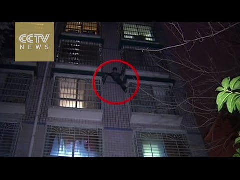 لص صيني يحاول الهرب على طريقة سبايدر مان